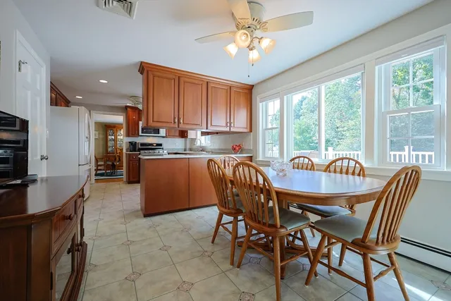 a view of a dining room with furniture window and outside view