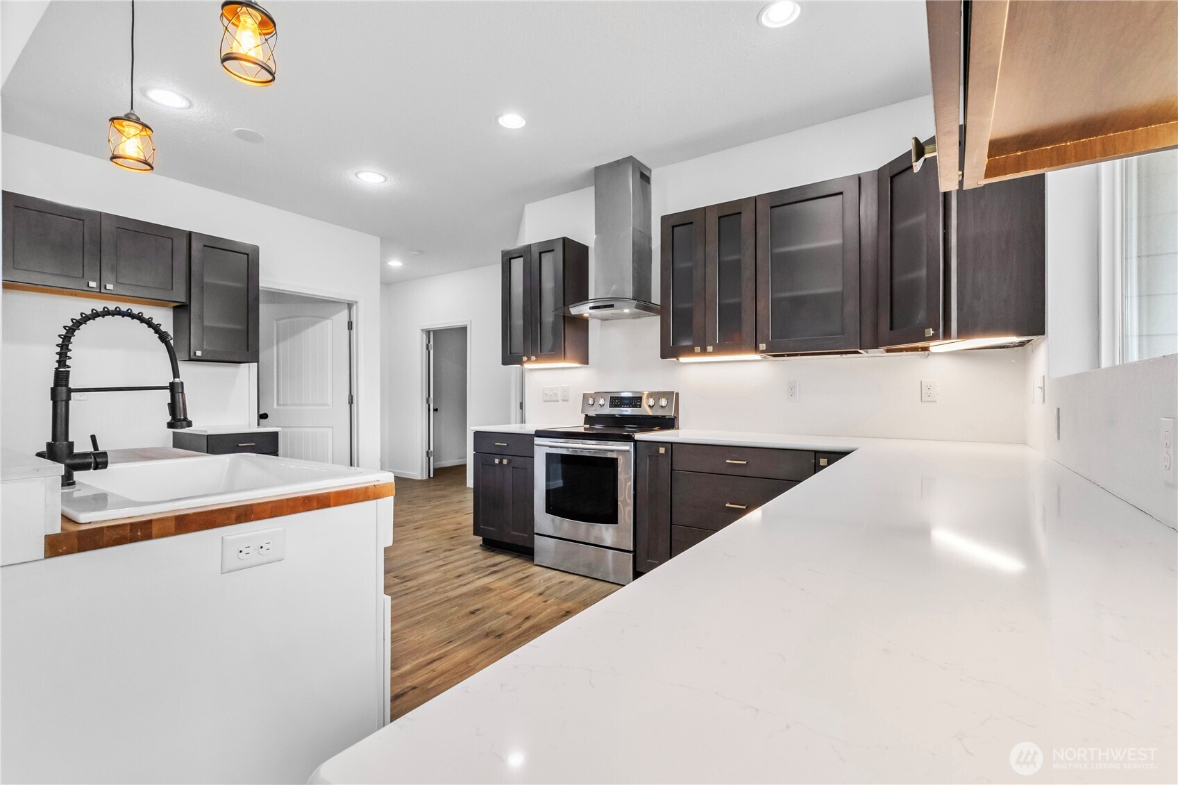 249 Flatt Road Kelso, WA 98626 - Photo 15 of 39 a large kitchen with stainless steel appliances kitchen island a large counter top a stove and a sink