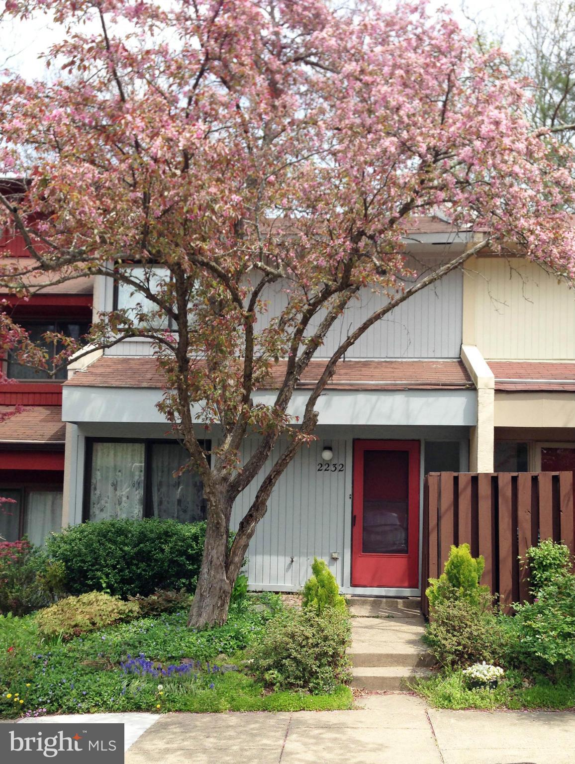 2232 White Cornus Lane Reston, VA 20191 - Photo 1 of 25 a front view of a house with garden
