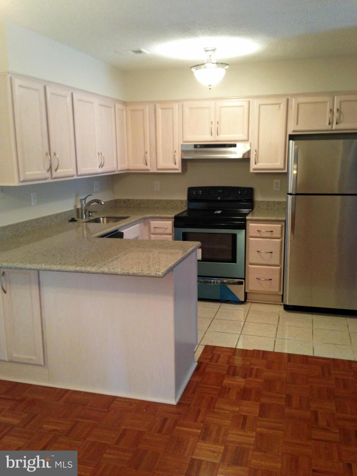 2232 White Cornus Lane Reston, VA 20191 - Photo 3 of 25 a kitchen with a cabinets and steel appliances