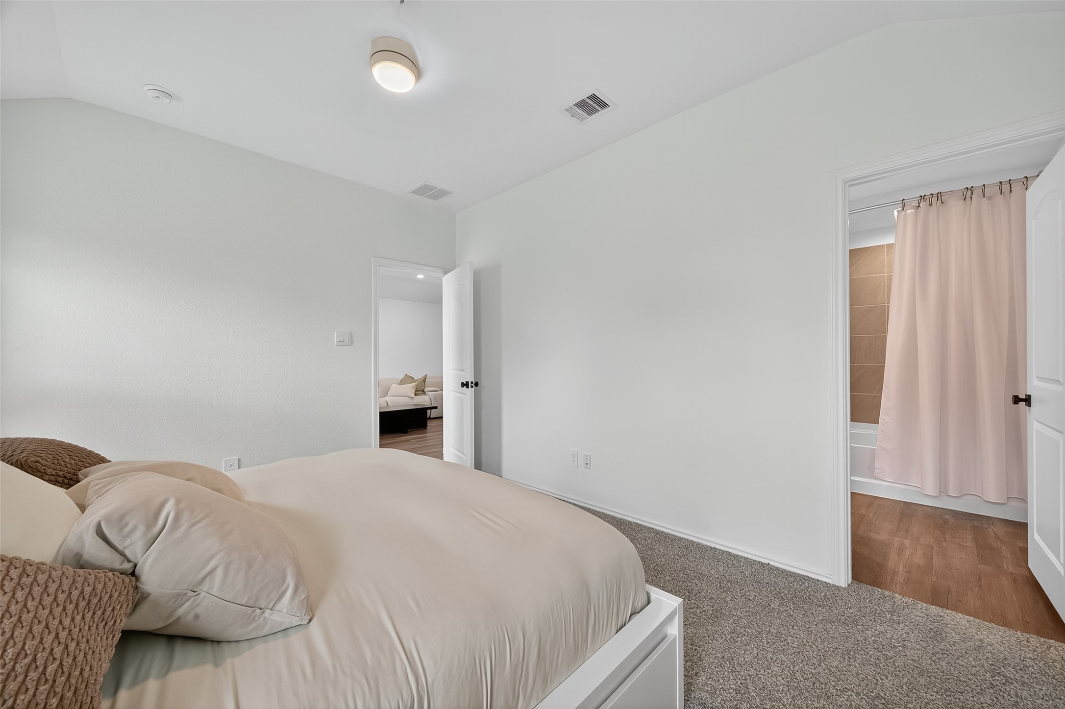 24422 Oriole Summit Drive Spring, TX 77373 - Photo 15 of 20 a bedroom with a bed and wooden floor