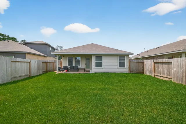 a view of a yard in front of a house