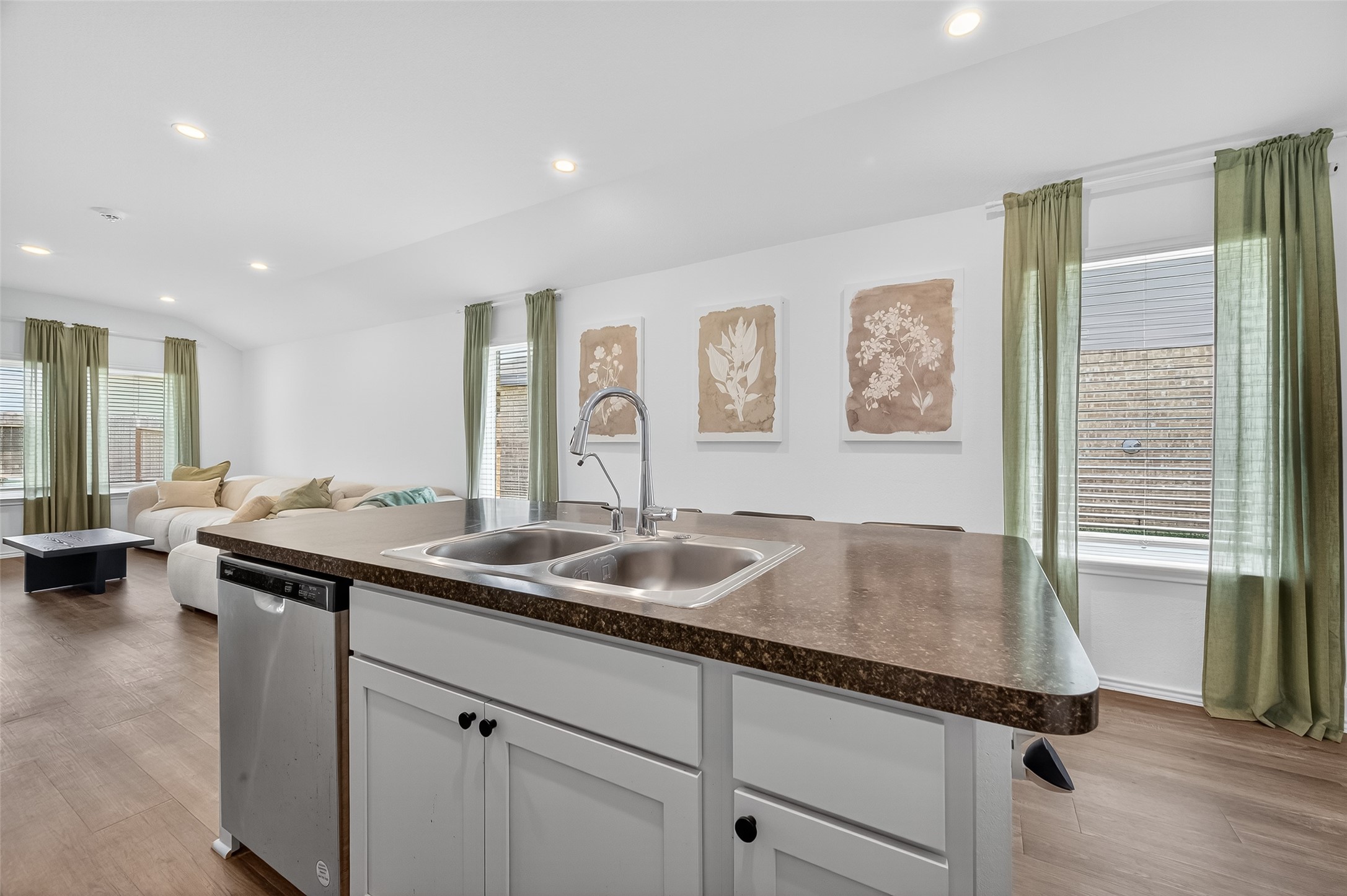 24422 Oriole Summit Drive Spring, TX 77373 - Photo 8 of 20 a kitchen with a sink and a refrigerator