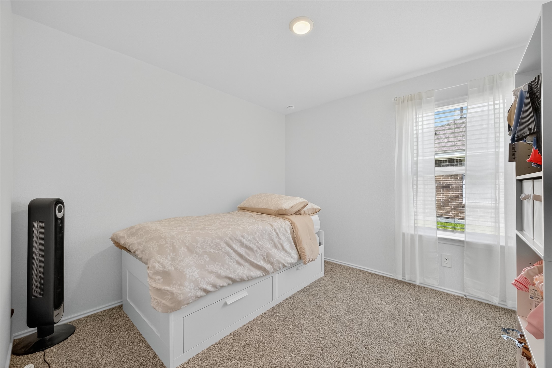 24422 Oriole Summit Drive Spring, TX 77373 - Photo 10 of 20 a bedroom with a bed and a window