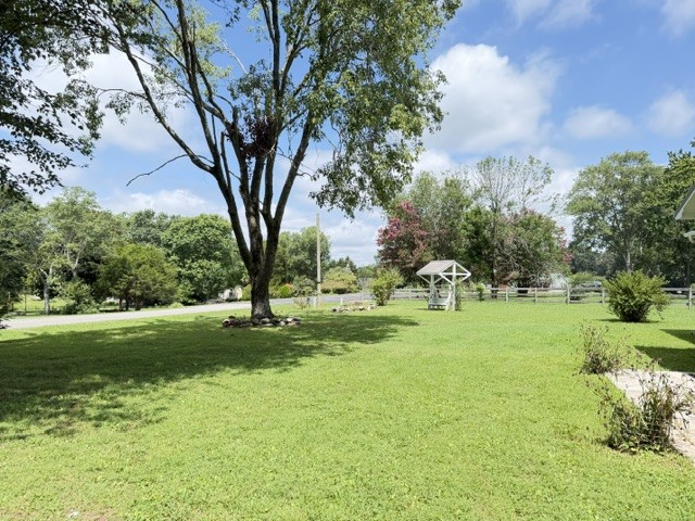 1300 Pleasant Ridge Road Huntland, TN 37345 - Photo 21 of 22 a big yard with lots of green space and fountain