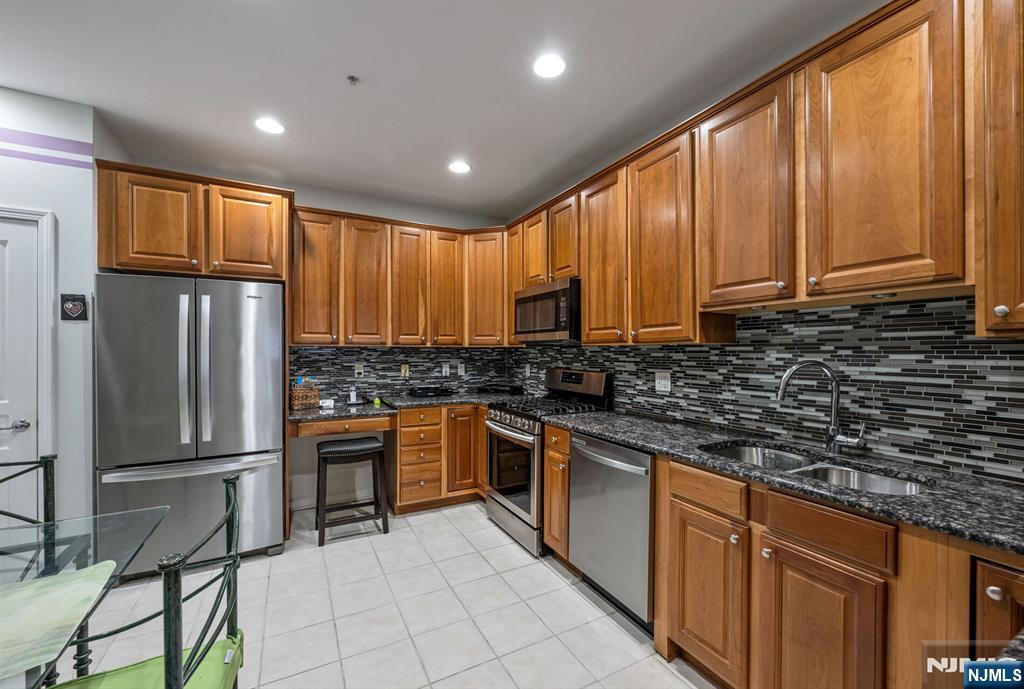 4203 Warren's Way Wanaque, NJ 07465 - Photo 11 of 35 a kitchen with stainless steel appliances granite countertop a refrigerator and a sink