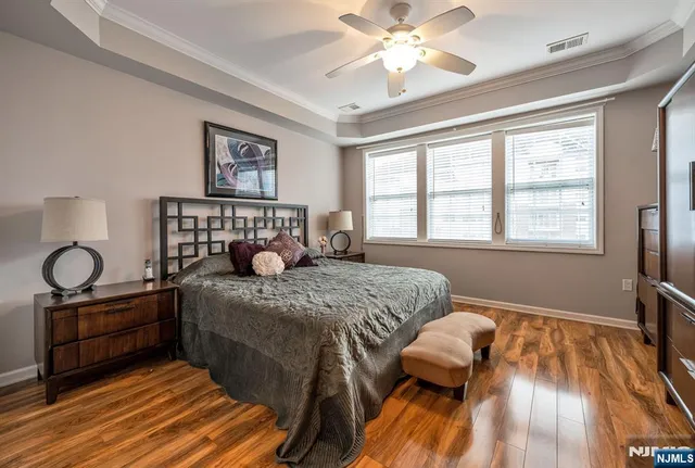 a bedroom with a bed and dresser