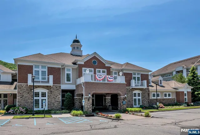 a living room with furniture or chandelier and a dining table