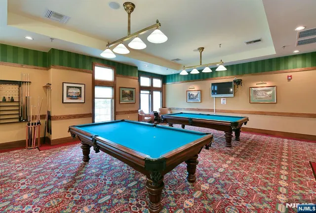 a view of a living room and dining room