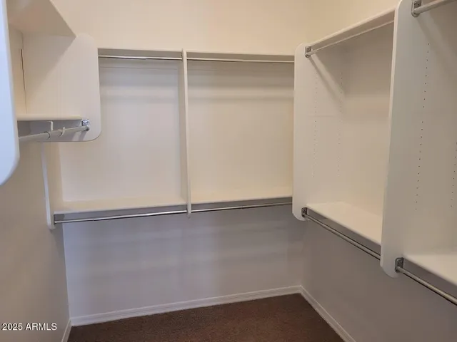 a view of an empty walk in closet