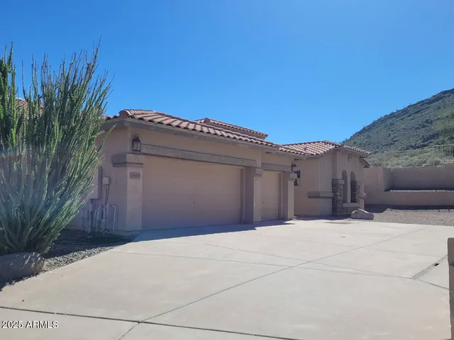 a front view of a house with a garage