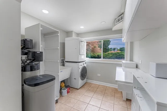 a kitchen with a refrigerator and a stove top oven