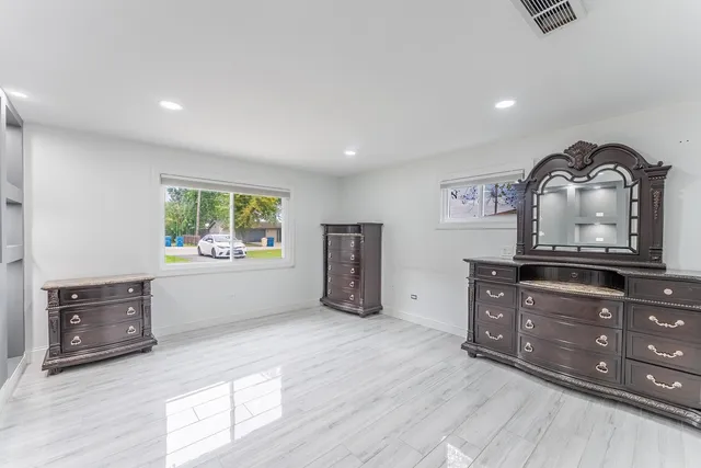 a room with furniture and wooden floor