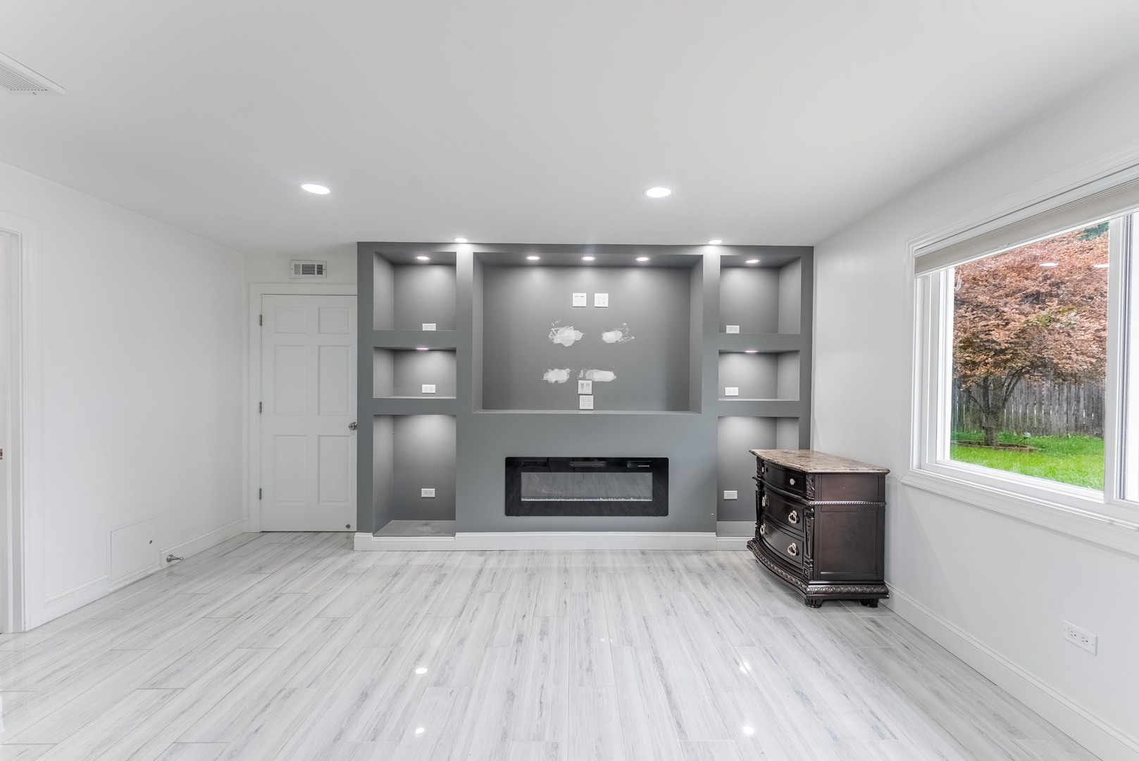 22819 Davy Court Plainfield, IL 60586 - Photo 21 of 36 an empty room with windows and fireplace