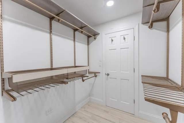 a bathroom with a shower and a sink