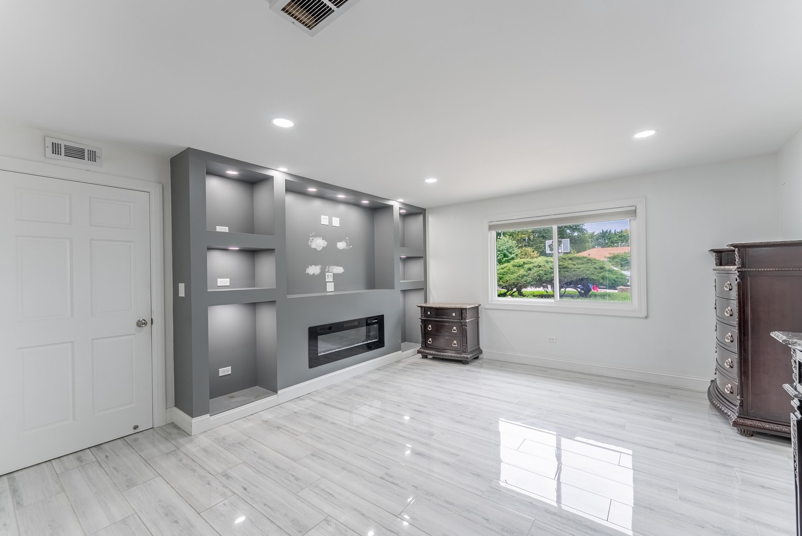 22819 Davy Court Plainfield, IL 60586 - Photo 24 of 36 an empty room with windows and fireplace
