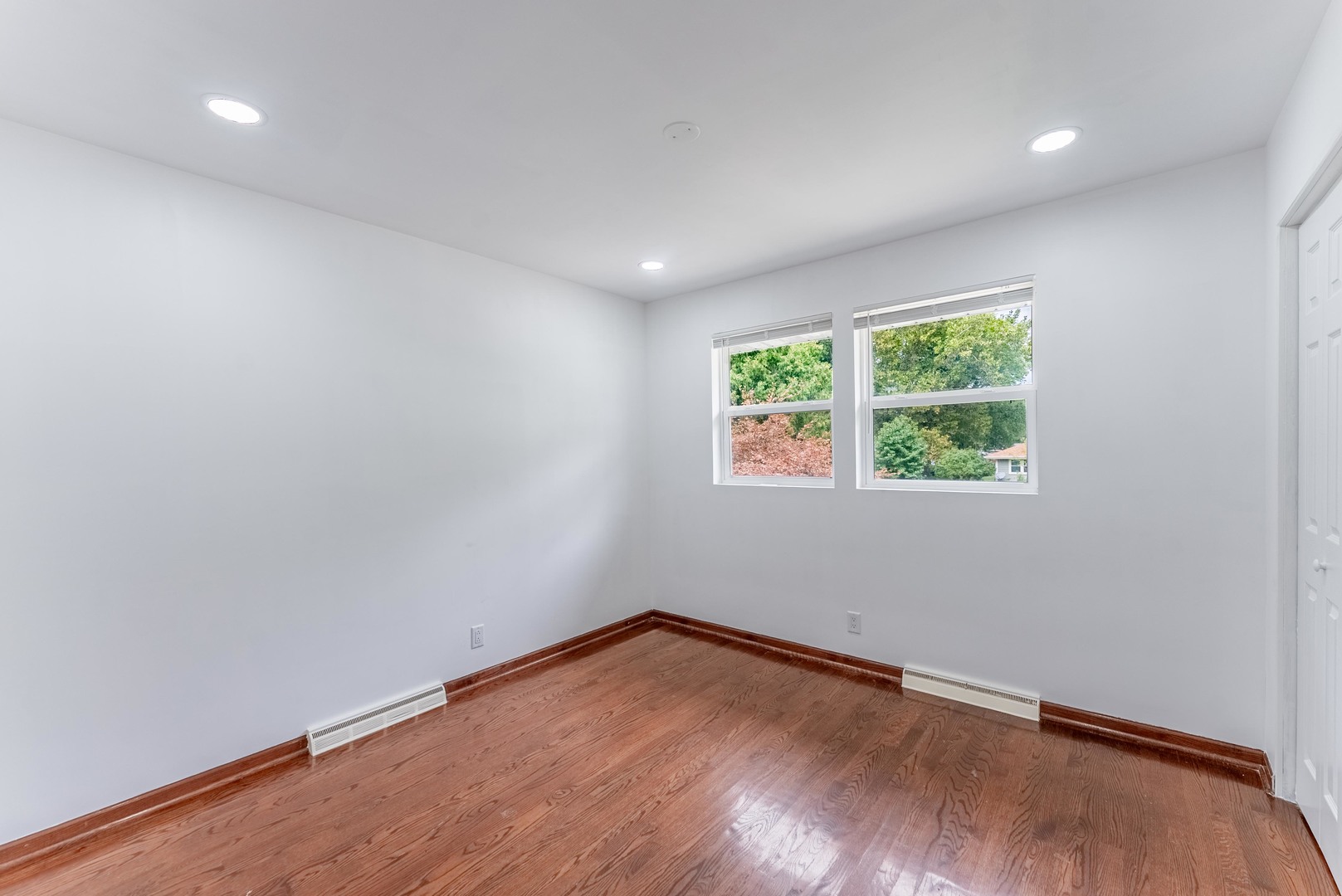 22819 Davy Court Plainfield, IL 60586 - Photo 28 of 36 an empty room with wooden floor and windows