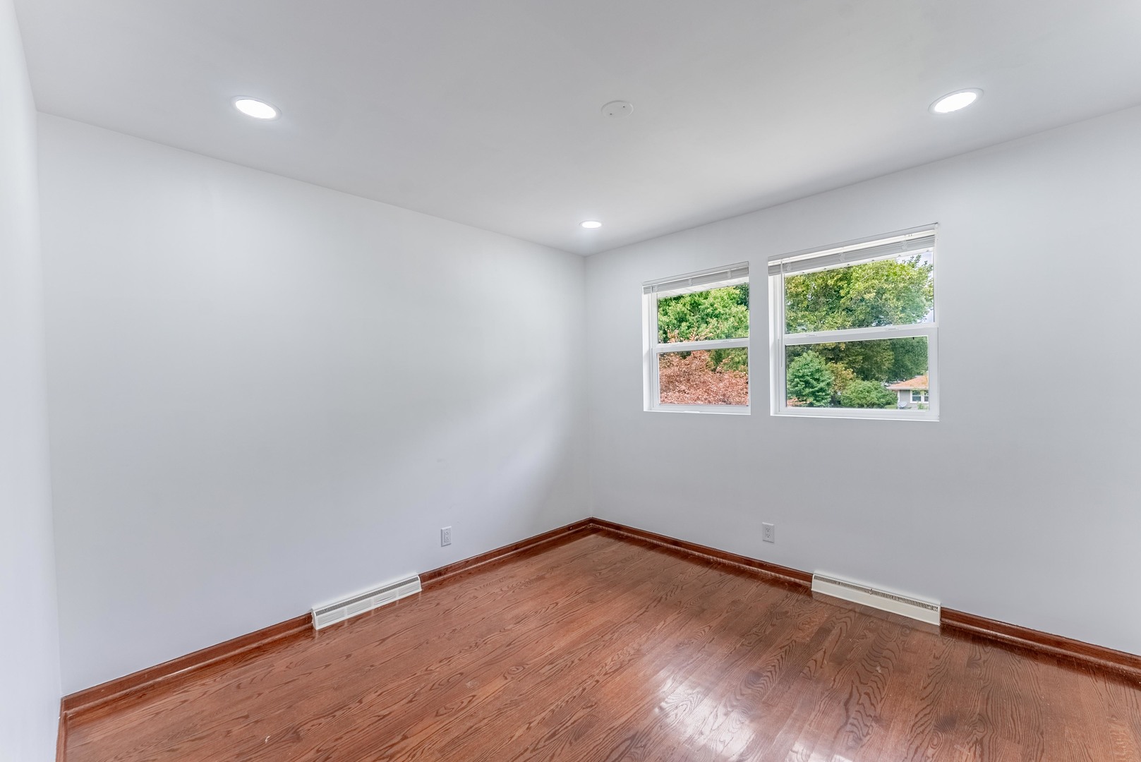 22819 Davy Court Plainfield, IL 60586 - Photo 29 of 36 an empty room with wooden floor and windows