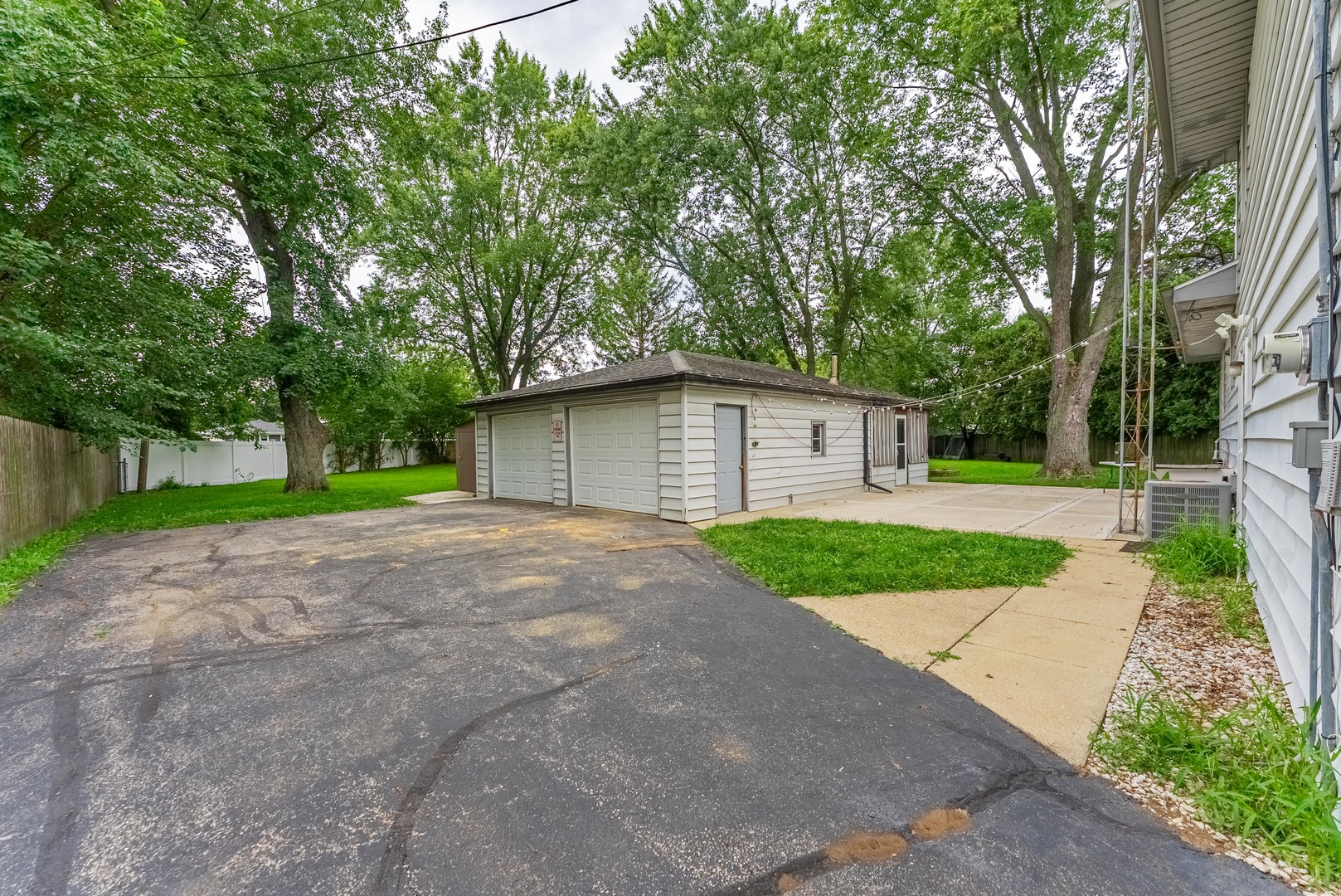22819 Davy Court Plainfield, IL 60586 - Photo 3 of 36 a view of a house with a yard and large trees