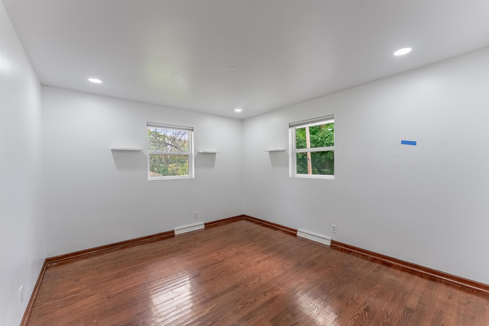 22819 Davy Court Plainfield, IL 60586 - Photo 33 of 36 an empty room with wooden floor and windows