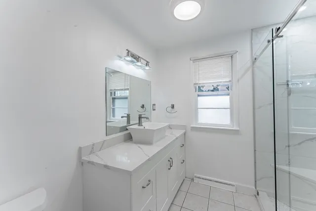 a bathroom with a bathtub and a shower