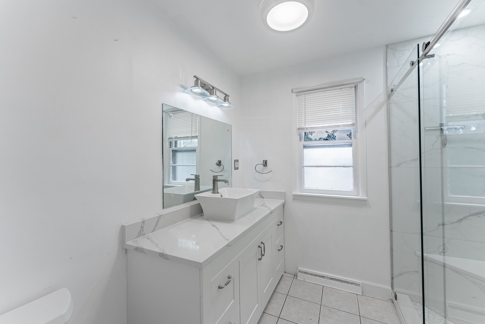 22819 Davy Court Plainfield, IL 60586 - Photo 35 of 36 a bathroom with a sink toilet and shower