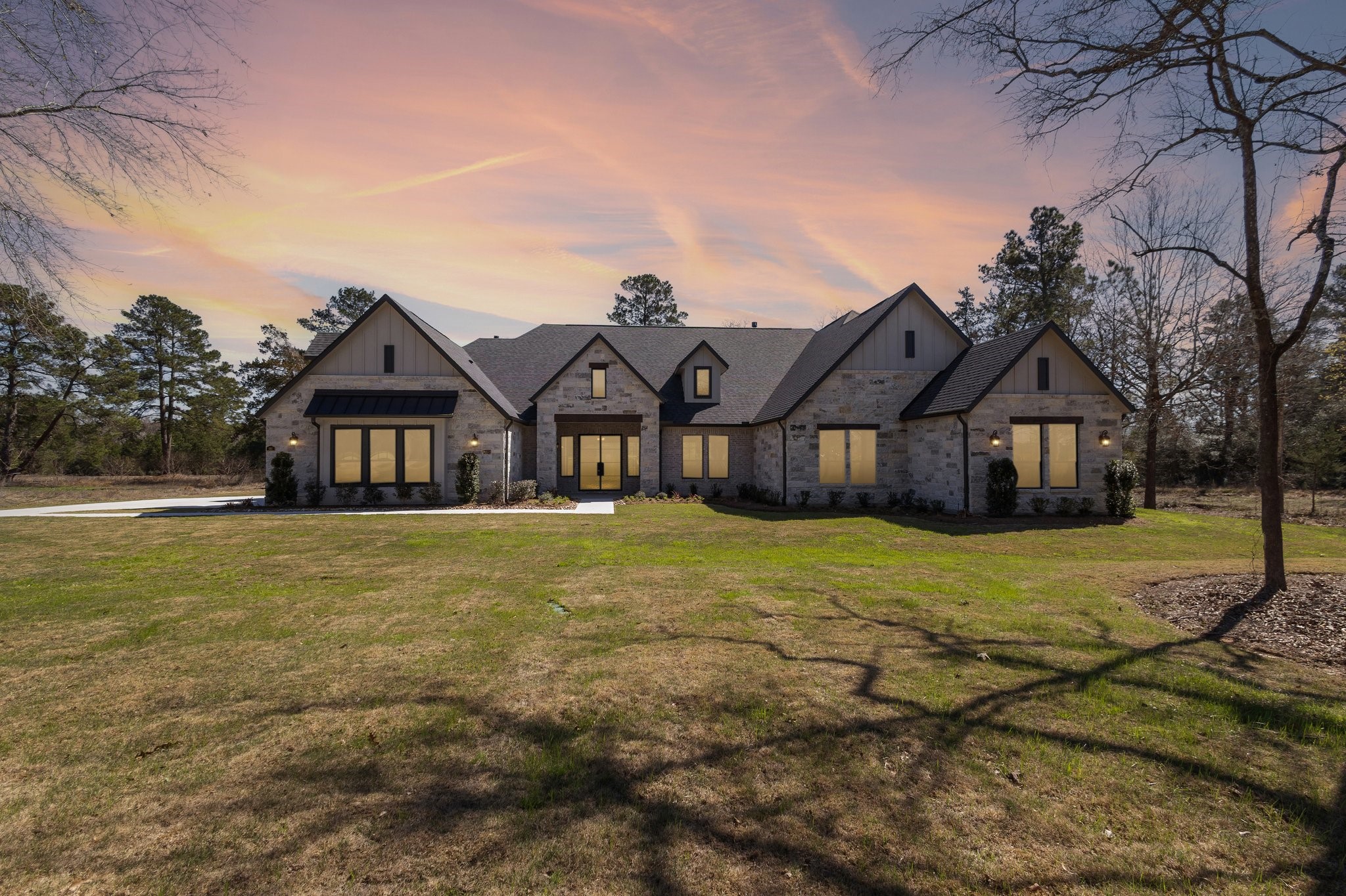 a front view of a house with a yard