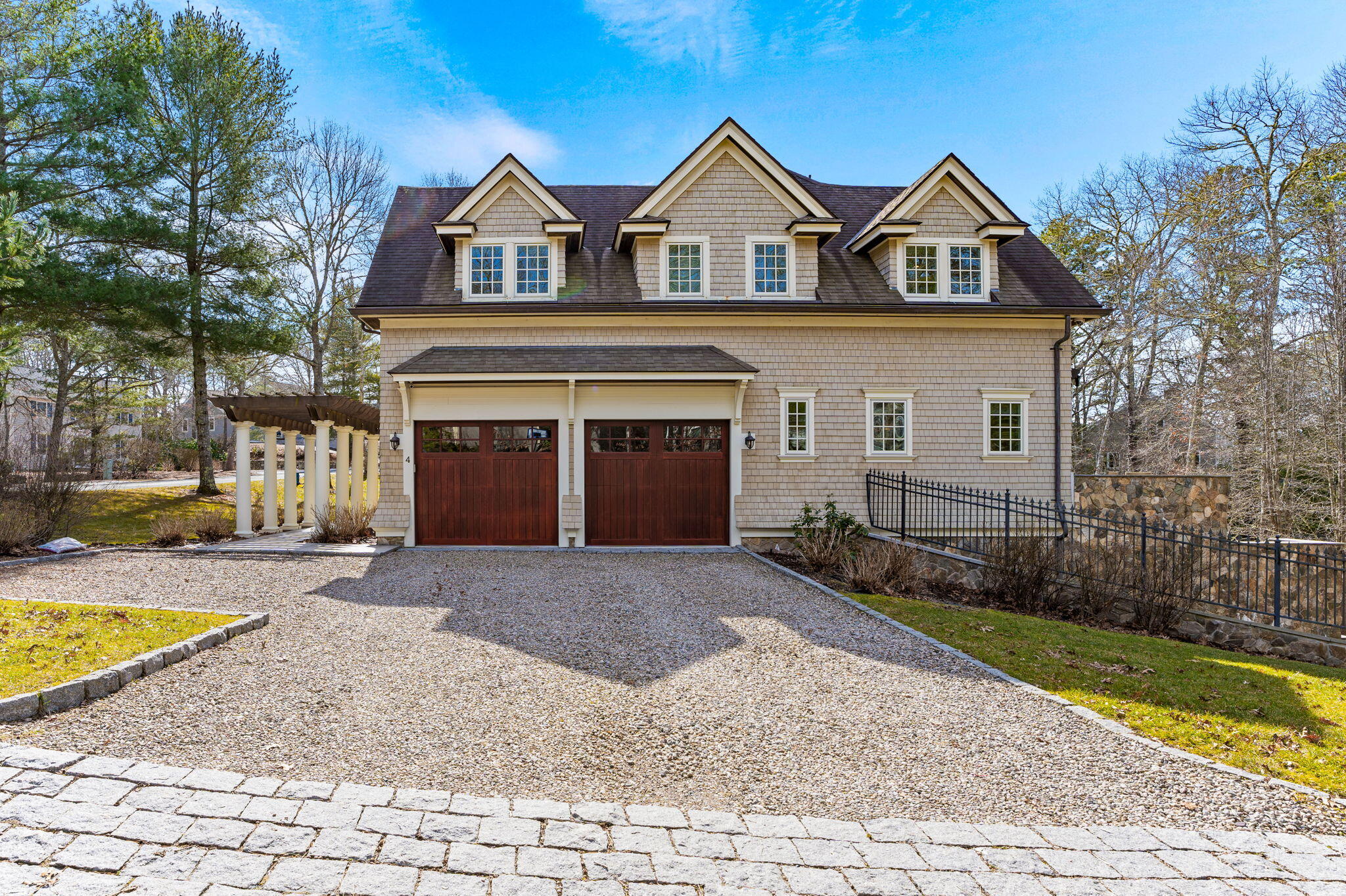 4 Vale Lane Mashpee, MA 02649 - Photo 6 of 33 a front view of a house with a yard and garage