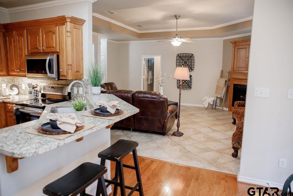1614 Pineview Lane Hideaway, TX 75771 - Photo 14 of 48 a living room with furniture and a flat screen tv