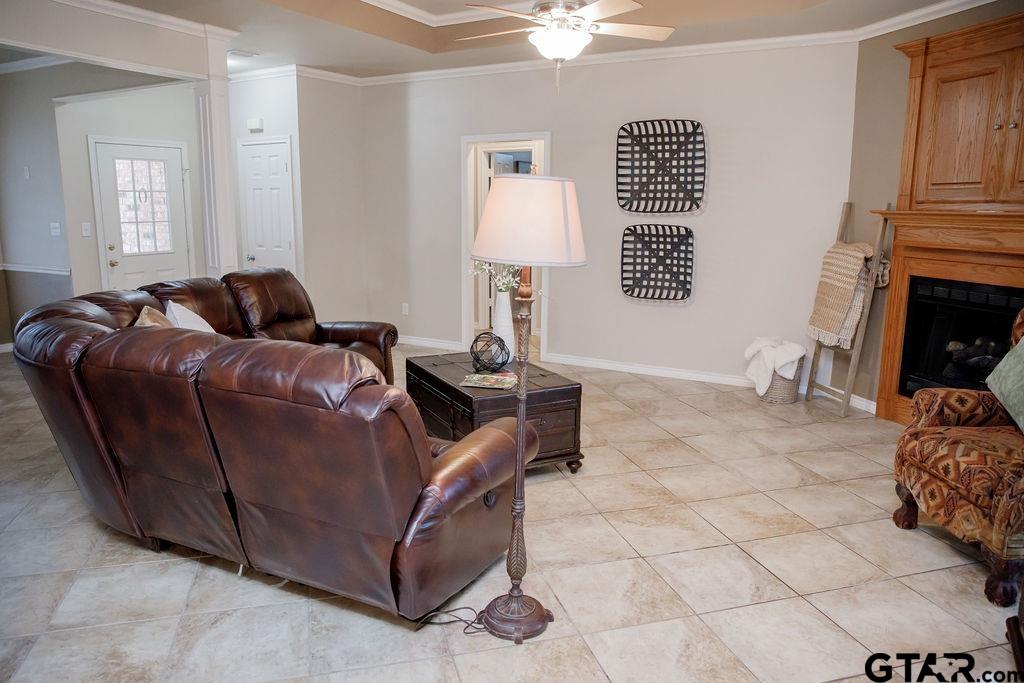 1614 Pineview Lane Hideaway, TX 75771 - Photo 16 of 48 a living room with furniture a table and a fireplace