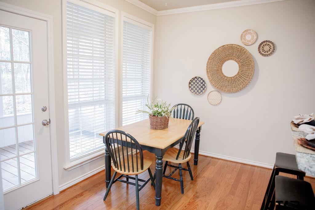 1614 Pineview Lane Hideaway, TX 75771 - Photo 18 of 48 a view of a dining room with furniture and wooden floor