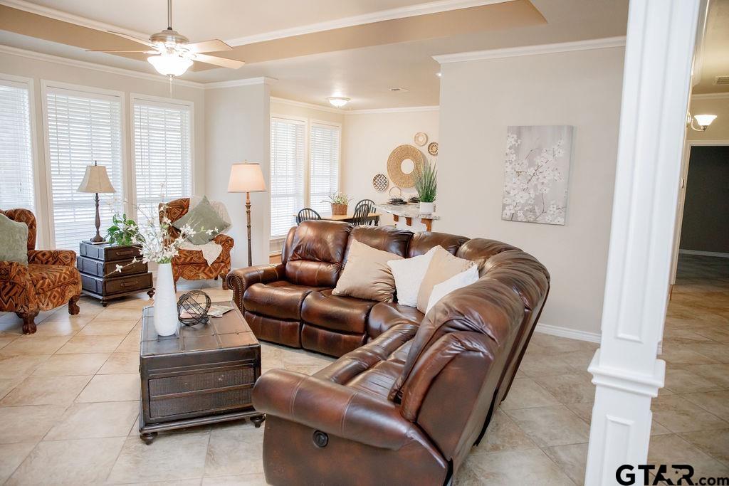 1614 Pineview Lane Hideaway, TX 75771 - Photo 23 of 48 a living room with furniture a chandelier and a large window