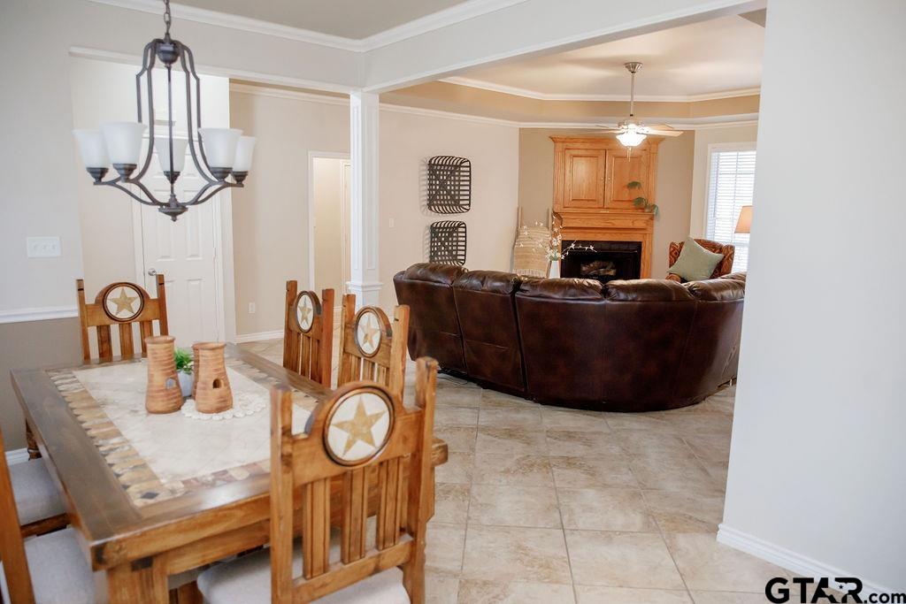 1614 Pineview Lane Hideaway, TX 75771 - Photo 27 of 48 a living room with furniture a chandelier and a large mirror