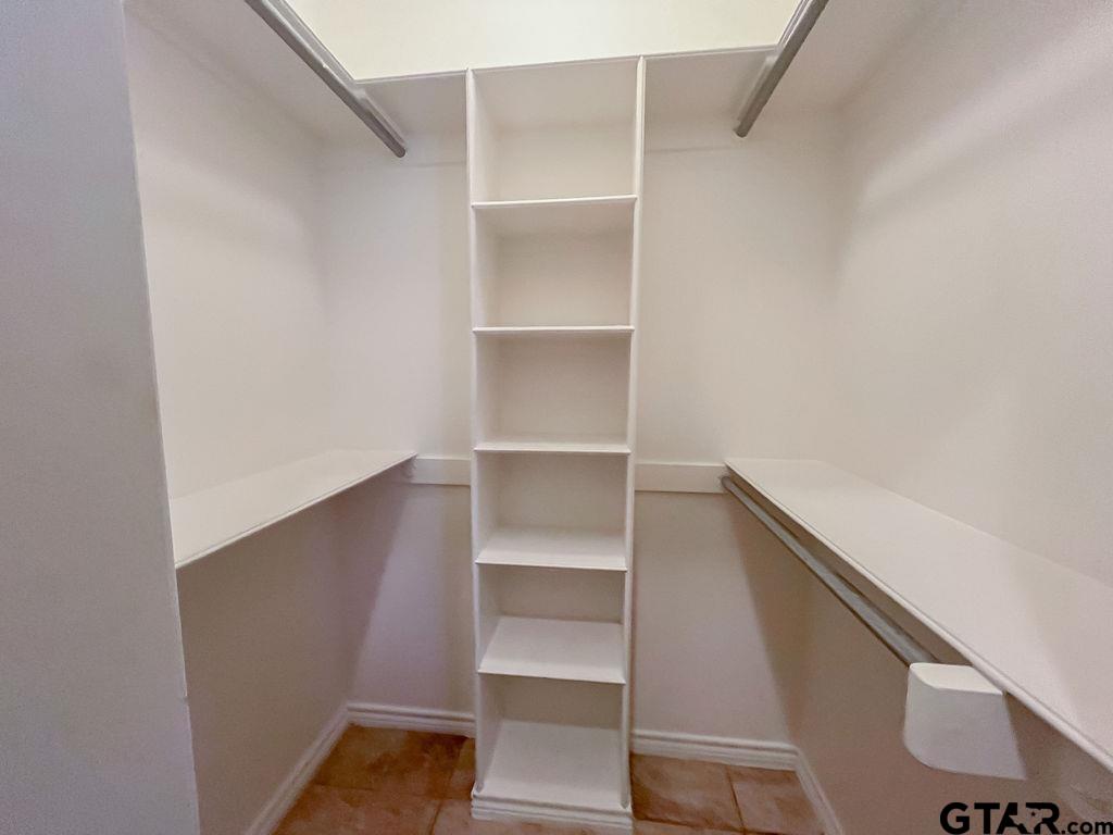 1614 Pineview Lane Hideaway, TX 75771 - Photo 32 of 48 a view of walk in closet with empty racks