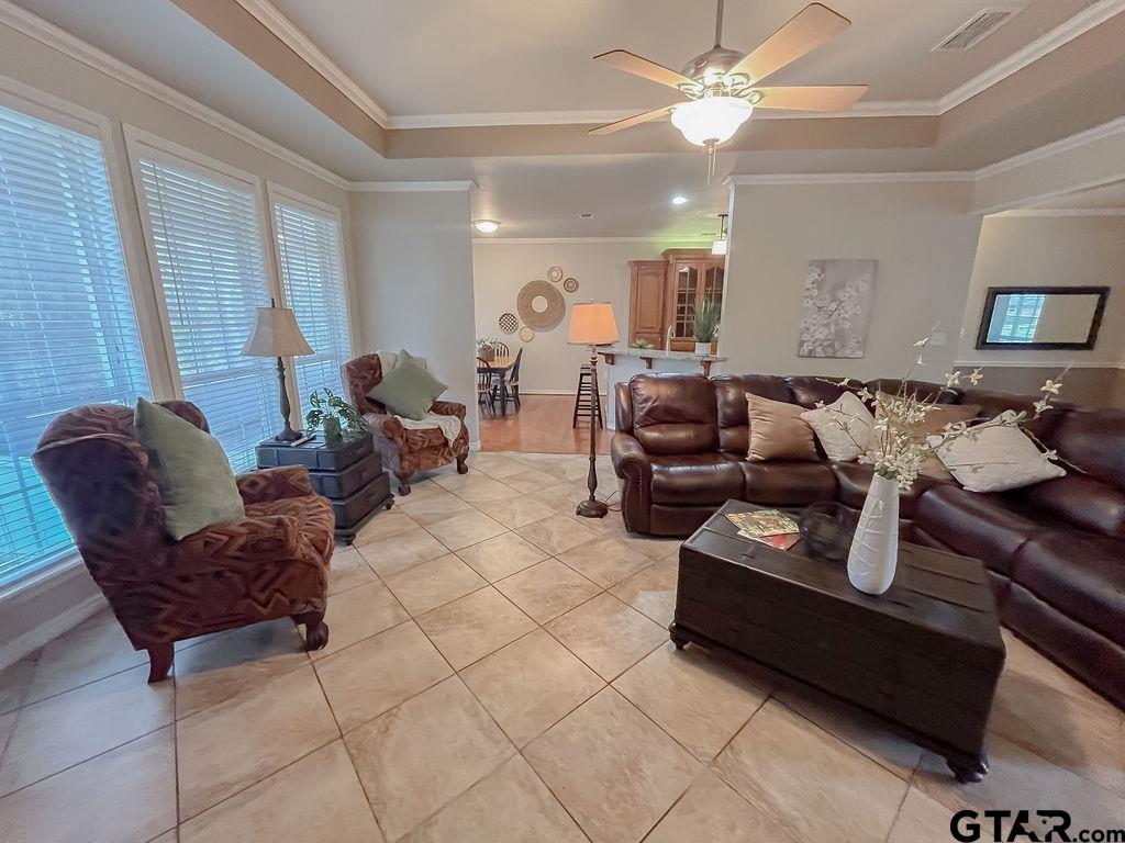 1614 Pineview Lane Hideaway, TX 75771 - Photo 36 of 48 a living room with furniture and a chandelier