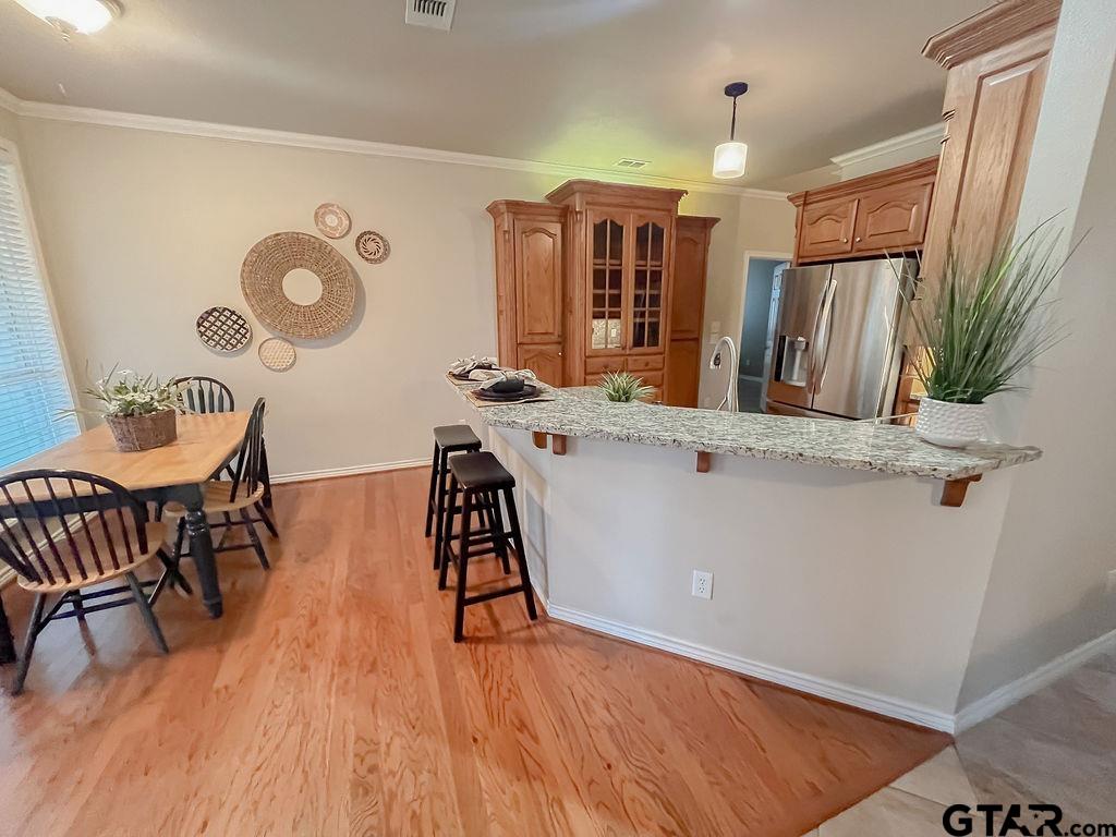 1614 Pineview Lane Hideaway, TX 75771 - Photo 39 of 48 a view of a kitchen with furniture and wooden floor