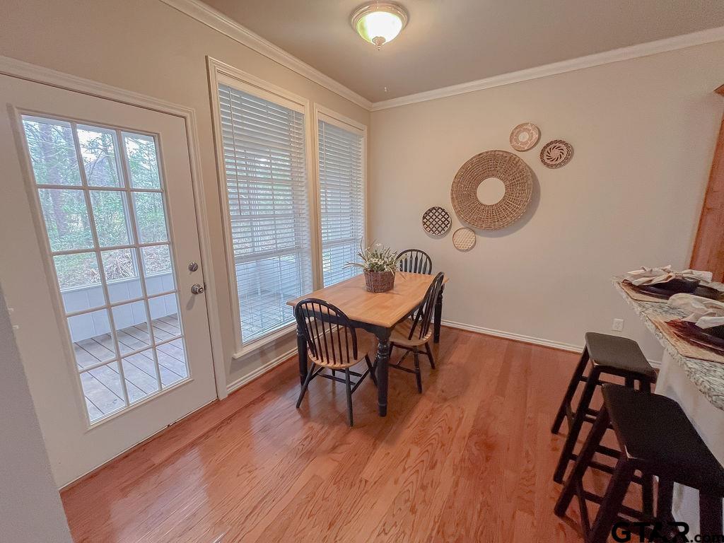 1614 Pineview Lane Hideaway, TX 75771 - Photo 40 of 48 a view of a dining room with furniture and wooden floor