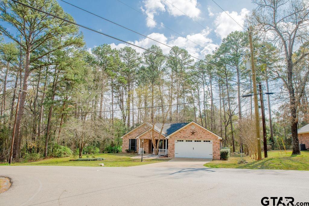 1614 Pineview Lane Hideaway, TX 75771 - Photo 4 of 48 a front view of house with yard and green space