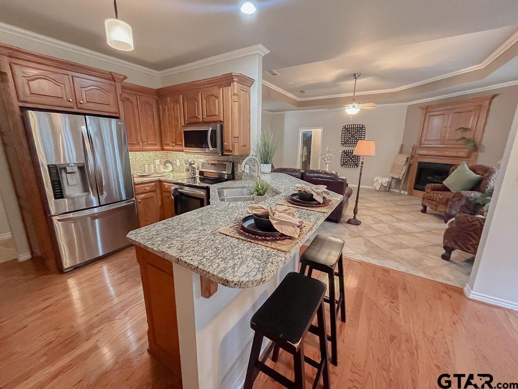 1614 Pineview Lane Hideaway, TX 75771 - Photo 42 of 48 a kitchen with a table chairs refrigerator and microwave