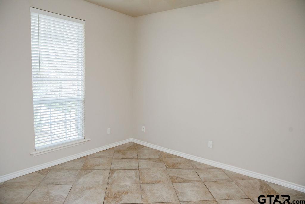 1614 Pineview Lane Hideaway, TX 75771 - Photo 9 of 48 an empty room with windows