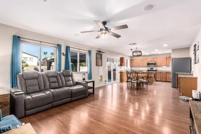 a living room with furniture and kitchen view