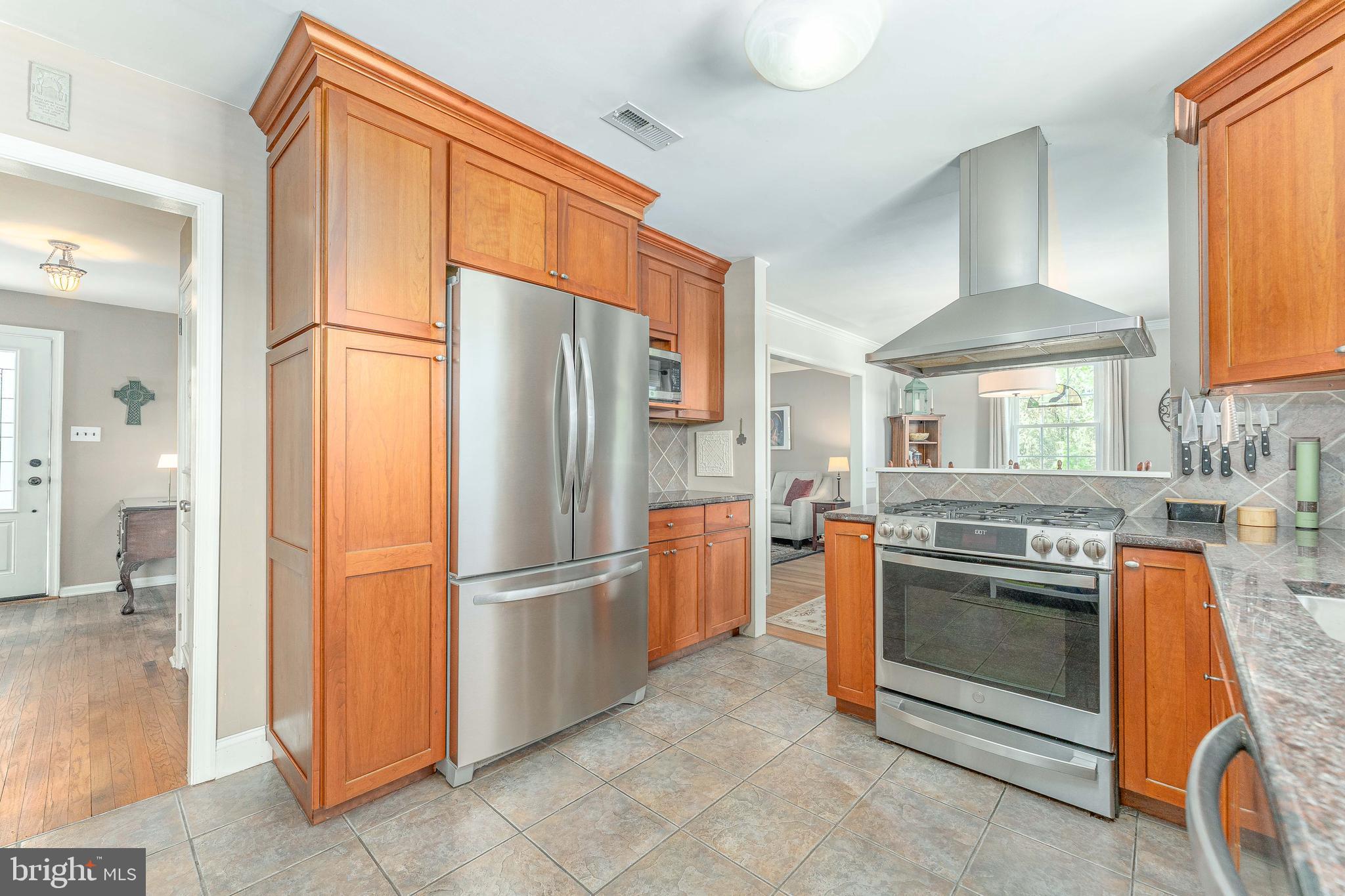 84 North Spring Lane Phoenixville, PA 19460 - Photo 13 of 51 a kitchen with stainless steel appliances granite countertop a refrigerator and a stove top oven