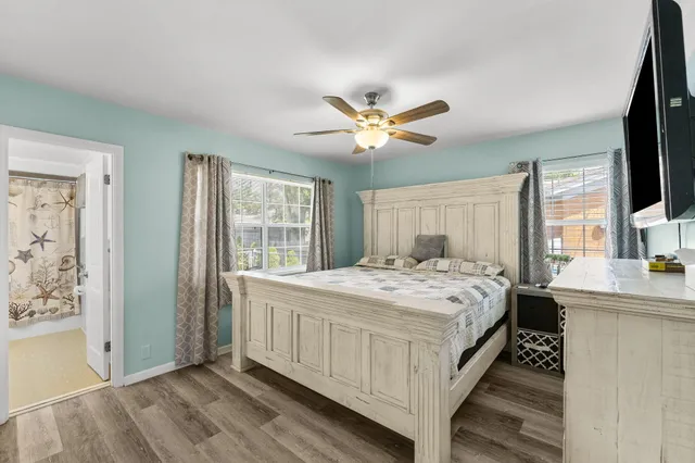 a bedroom with a large bed and a window