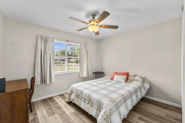 a bedroom with a bed and window