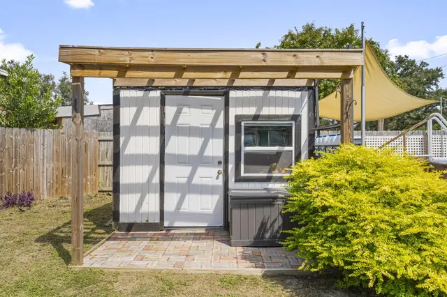 a view of swimming pool with outdoor seating