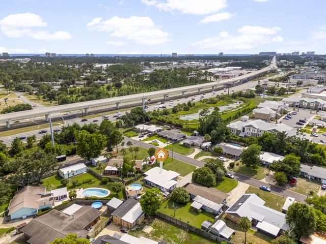 an aerial view of residential houses with outdoor space