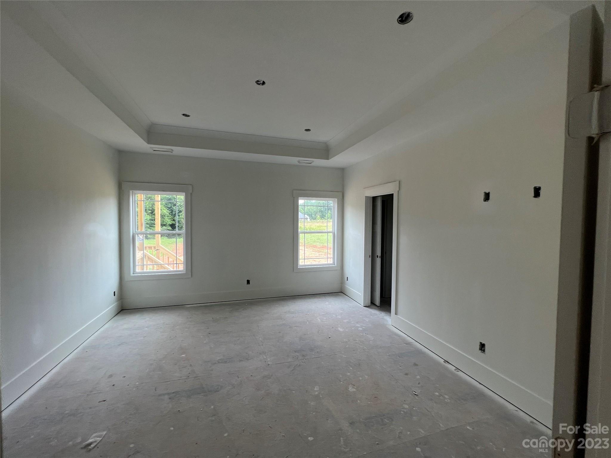 8018 Smooth Stone Court, Unit 71 Clover, SC 29710 - Photo 11 of 21 a view of empty room with windows