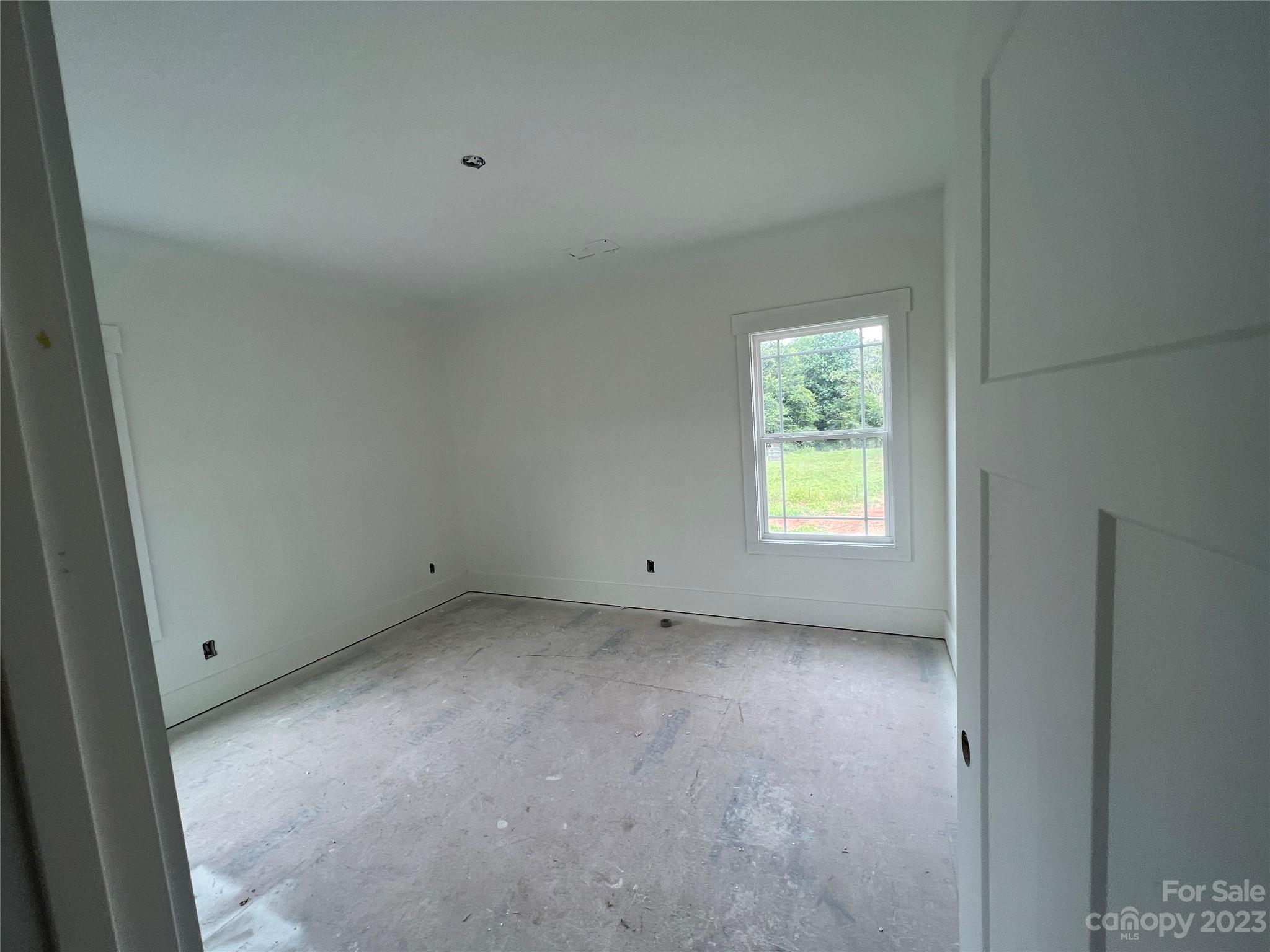 8018 Smooth Stone Court, Unit 71 Clover, SC 29710 - Photo 15 of 21 an empty room with a window