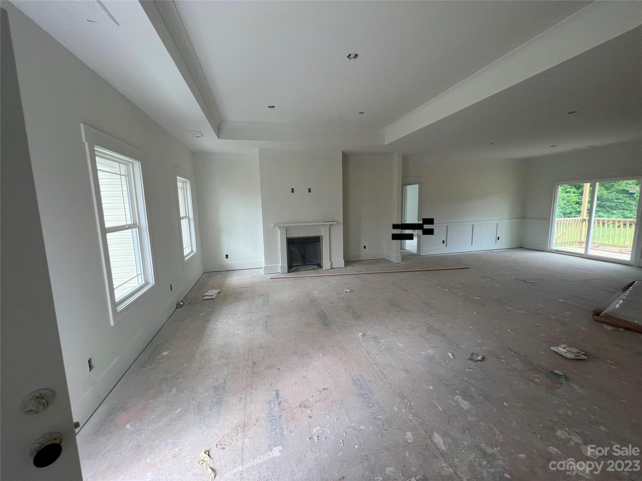 8018 Smooth Stone Court, Unit 71 Clover, SC 29710 - Photo 16 of 21 a living room with furniture and a fireplace