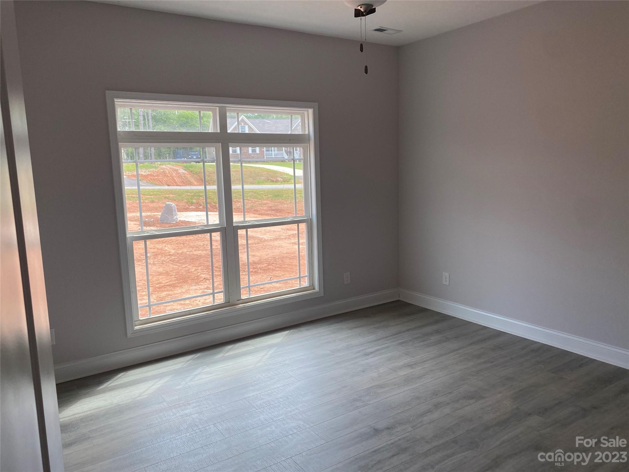 8018 Smooth Stone Court, Unit 71 Clover, SC 29710 - Photo 5 of 21 an empty room with a window